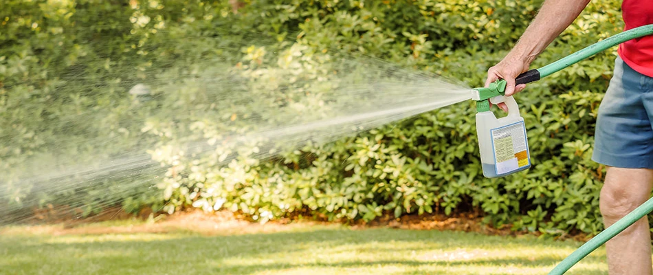 Our lawn care specialist performing liquid aeration on our client's lawn in East Greenville, PA.