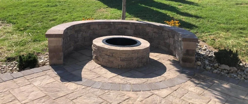 Fire pit and seating wall on a property in Cetronia, PA.