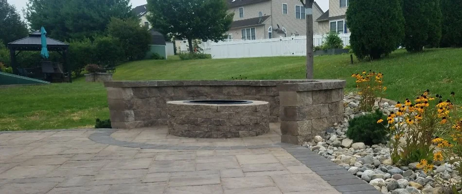 Round fire pit in Fountain Hill, PA, with seating wall.