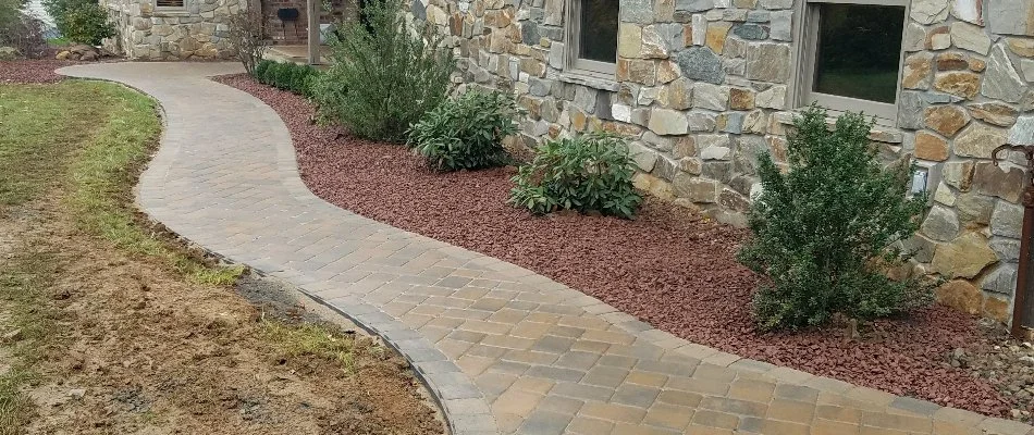 Walkway in Hokendauqua, PA, along a mulched landscape bed.
